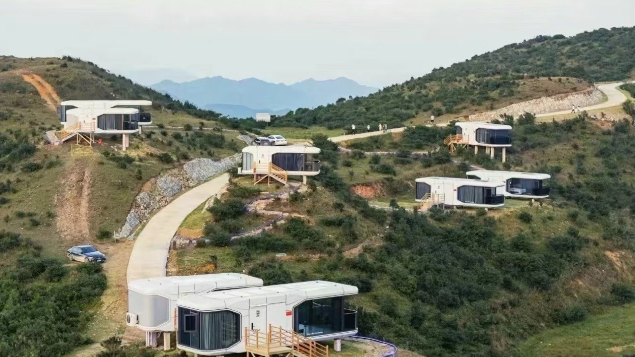Capsule resort deployed along a hillside road